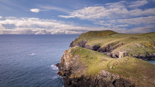 An aerial view of Doyden Castle on the cliffs overlooking the sea, Cornwall